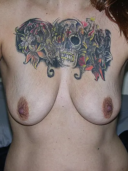 MILF BIKER BABE SHOWS TATTOOED TITS