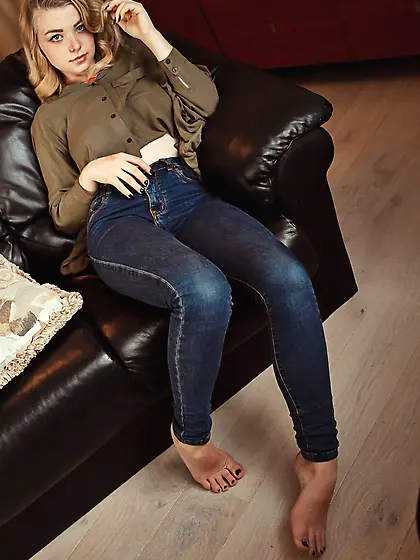 Pale blonde with wild hair shows off that perfect-looking slit o