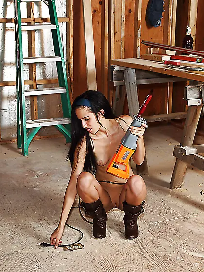 Wild brunette poses in boots only then masturbates with drildo i