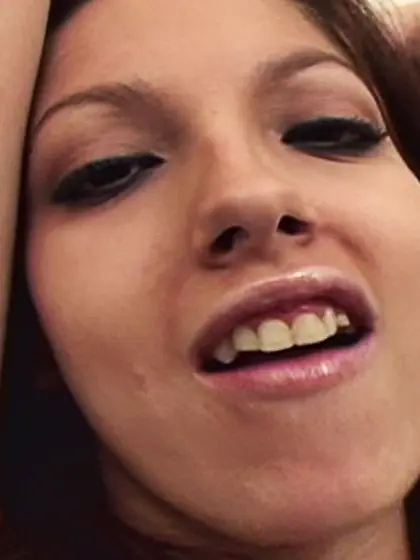 Cute slut gets on the sofa to please two...