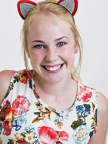 Love with pussy ears hugs and rides a plush panda with balloons