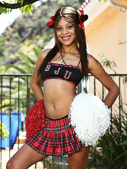 Black cheerleader doesn't put pom-poms down even during a naked