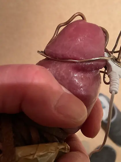 Estim,  foreskin stretched back,  glans cbt