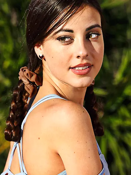 Pretty brunette chick Lorena Morena is smiling and showing off t