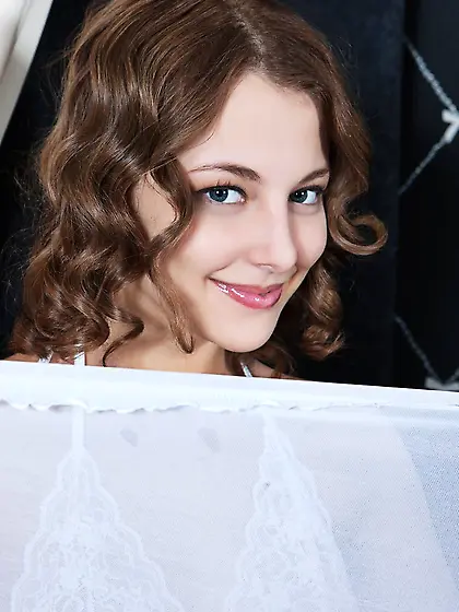 The seducing teen Nikia A is playing around covered with white l