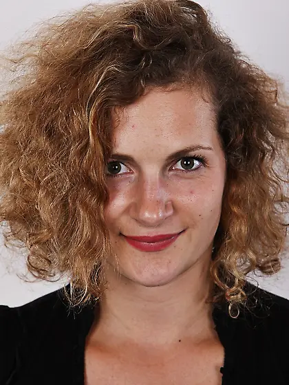 Curly brunette posing black