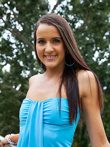 Brunette teen sits beach