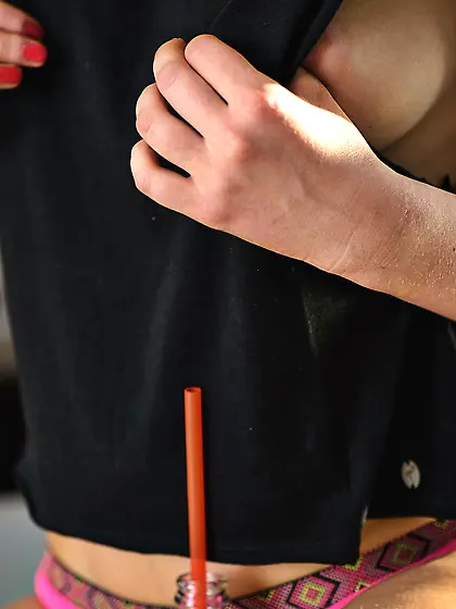 Wavy-haired blonde in a black top has too much fun with her popc