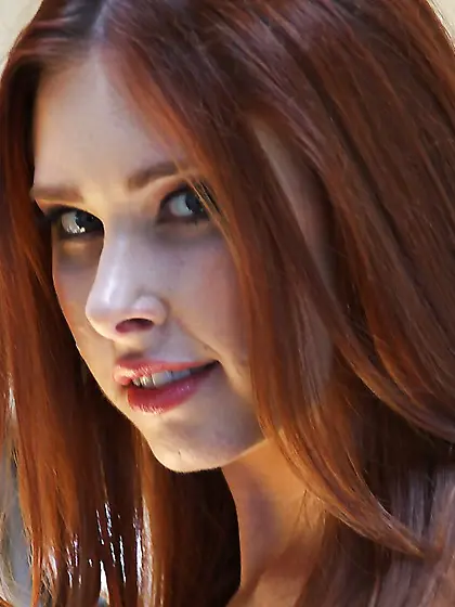 Sweet redhead permits director to film her perfect butt dressed