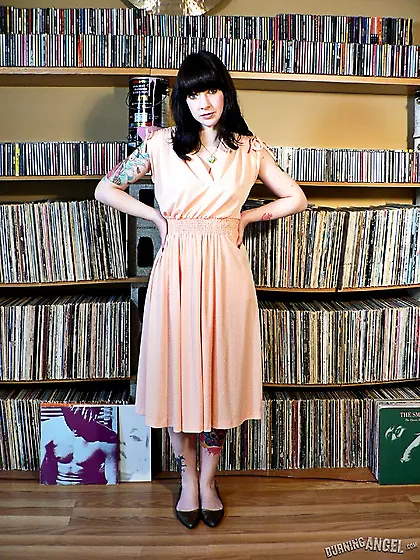 Raven haired beauty strips