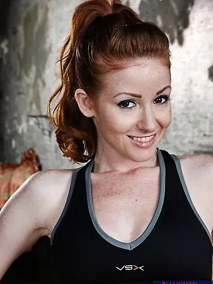 Natural redhead Nikki Rhodes with tattoo on her belly gets her t