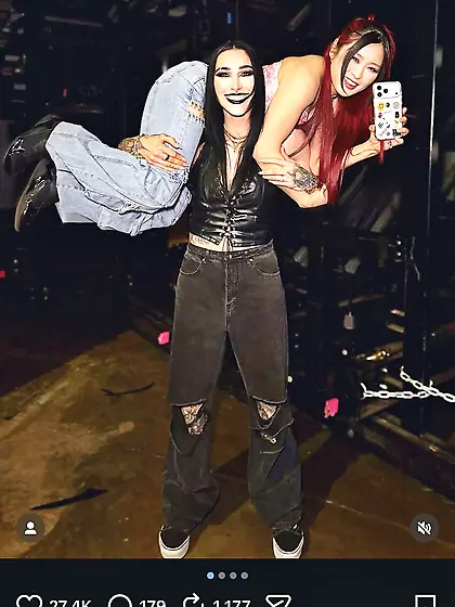 Rhea Ripley carrying Iyo Sky