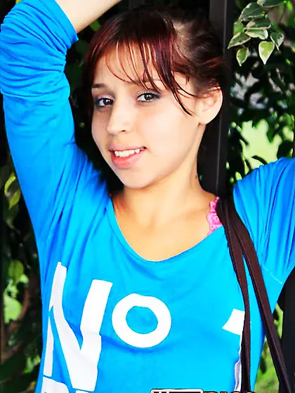 Attractive redhead with a firm behind showing off for the cam