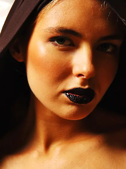 Dark-haired babe with edgy Asian body art posing naked for the c