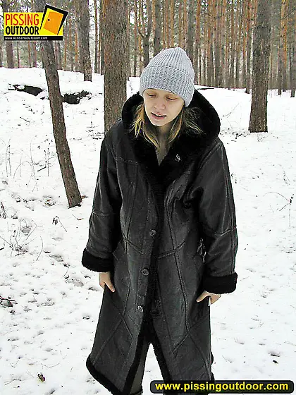 Pissing outdoor in the winter forest