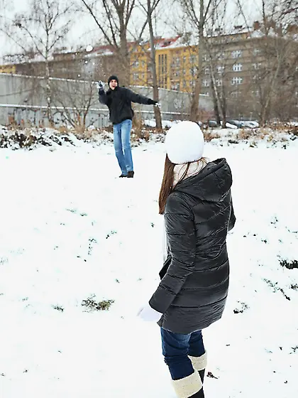 Spicy girl plays in the snow with young man and hurries home to