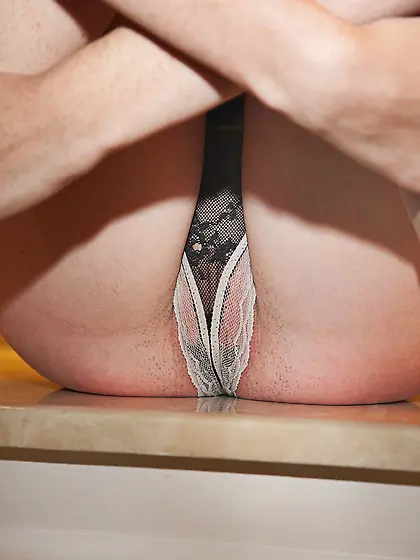 Slim red teen in glasses gets naked to take...