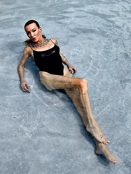 Katie Cassidy in a black swimsuit