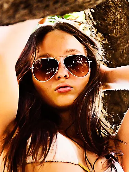 This naked brunette nymph Catherine Hammat is sexily posing on t