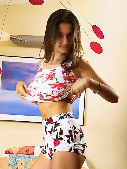 Busty teen cuttie Felicity Fey takes off her underwear and shows