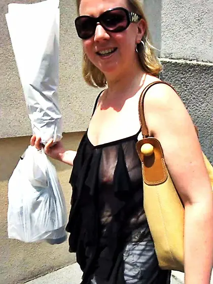 In a frilly black top on the street