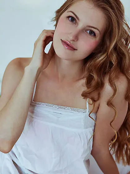 Curvy redhead bombshell strips