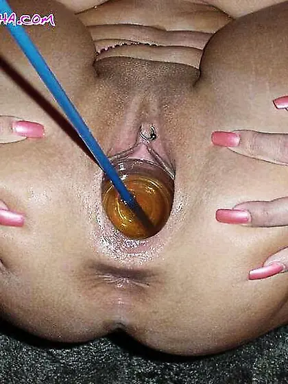 Drinking piss with a straw directly from her pussy