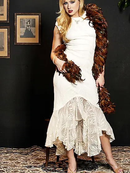 Blonde pornstar Nikki Kane turns around to show her shapely ass