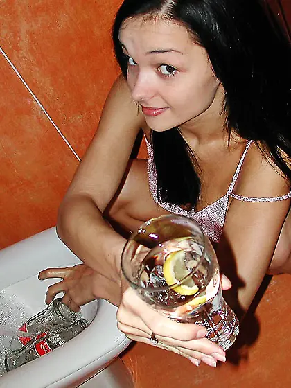 Foxy teen babe Katie Fey takes off her little thongs and reveals