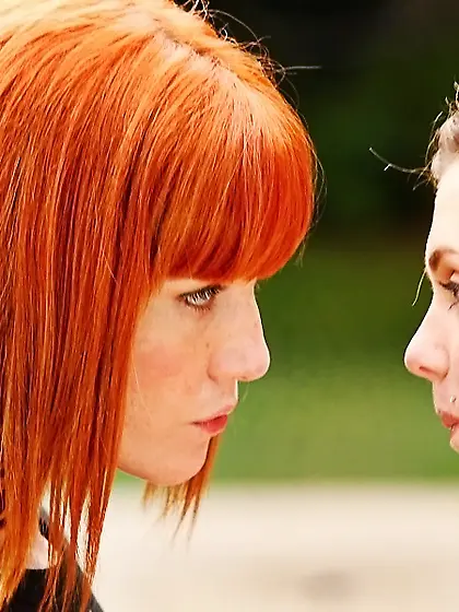 Innocent girlfriends meet outdoors to have naked foreplay in par