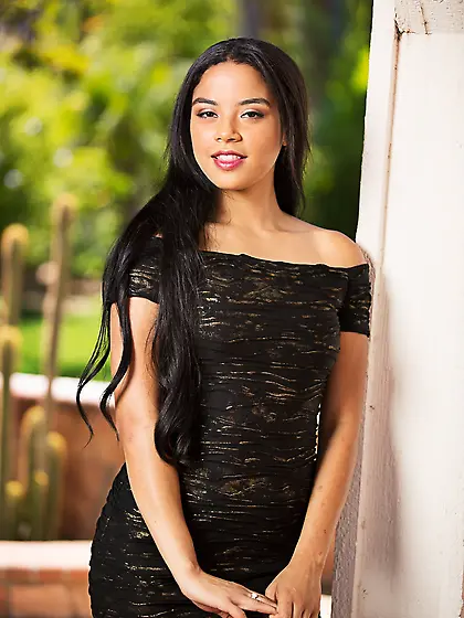 Angelic Latina beauty removes her slinky dress and smiles as pos