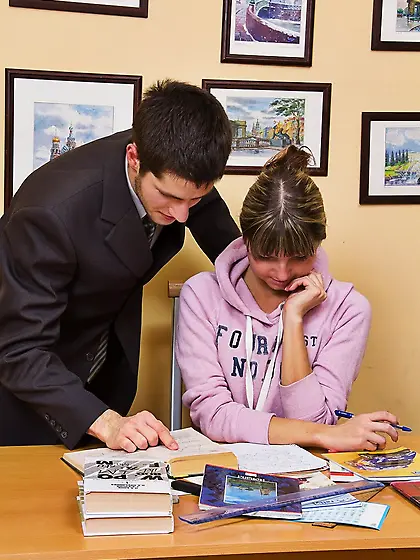 Valya C gets fucked doggystyle over the desk by her teacher