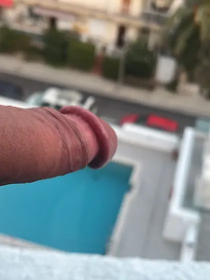 Pointing down to the streets below