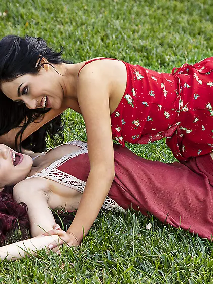 Sabina Rouge and Jade Baker licking passionately on the grass