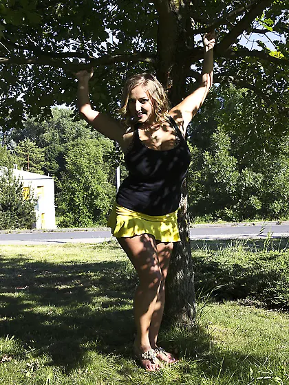 Thick wavy-haired blonde drops to her knees to suck that cock