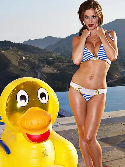 Emily Addison with big tits and bald pussy poses naked in red sh