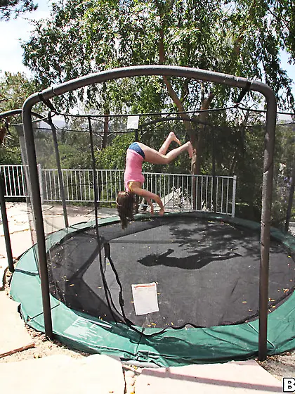 Cute brunette shows off her body before bravely straddling a bla