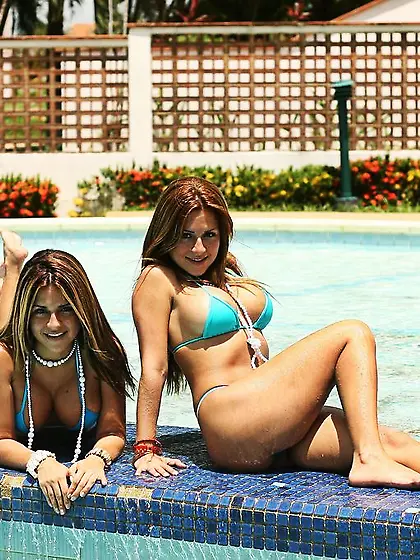 Hailey and Ashley splash around at the pool