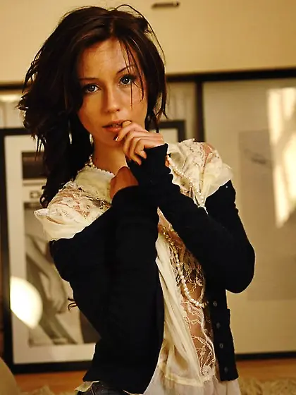 Playful brunette undresses before spreading legs to demonstrate