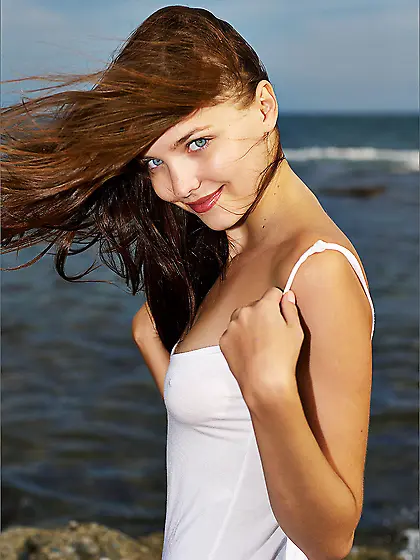 Dark haired Amelie Femjoy shows her hot butt on her outdoor phot