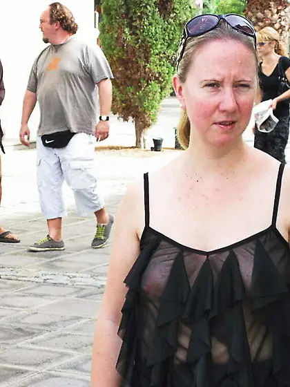 In a frilly black top on the street