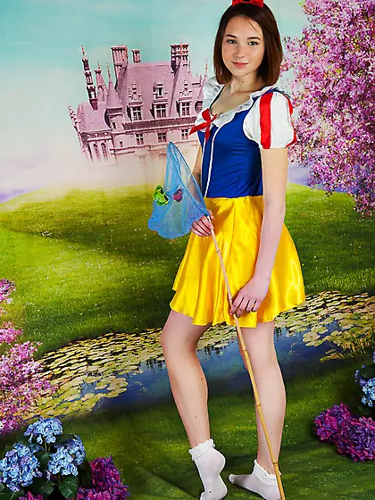 Ginger witch with a net puts her naked boobs and slit in the win