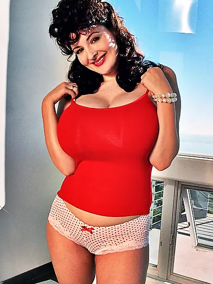 Sexy brunette Lorna Morgan showing her huge honkers and playing