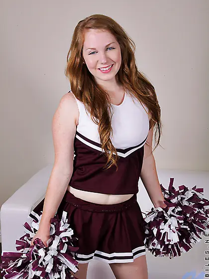 Adorable little cheerleader cutie reveals her tits and starts to