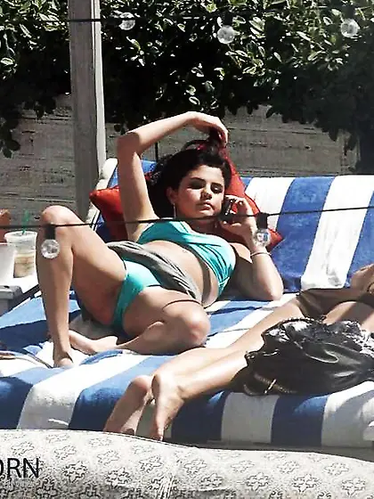 Selena Gomez - bathing suit with open up gams