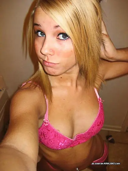 Pink lingerie blue-eyed blonde shows her...