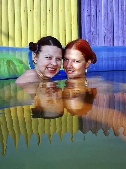 Lesbian teen with nice hairstyle dildoes redhead's pussy in air