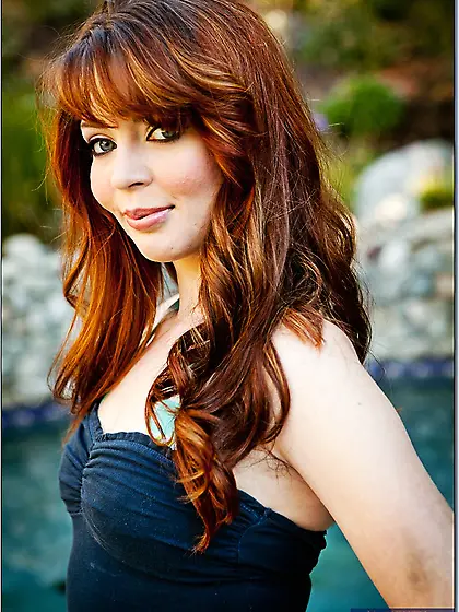 Alluring redhead mom