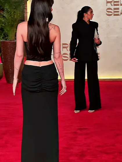 Dakota Johnson in a plunging black dress