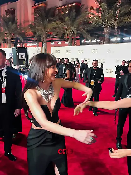 Dakota Johnson in a plunging black dress